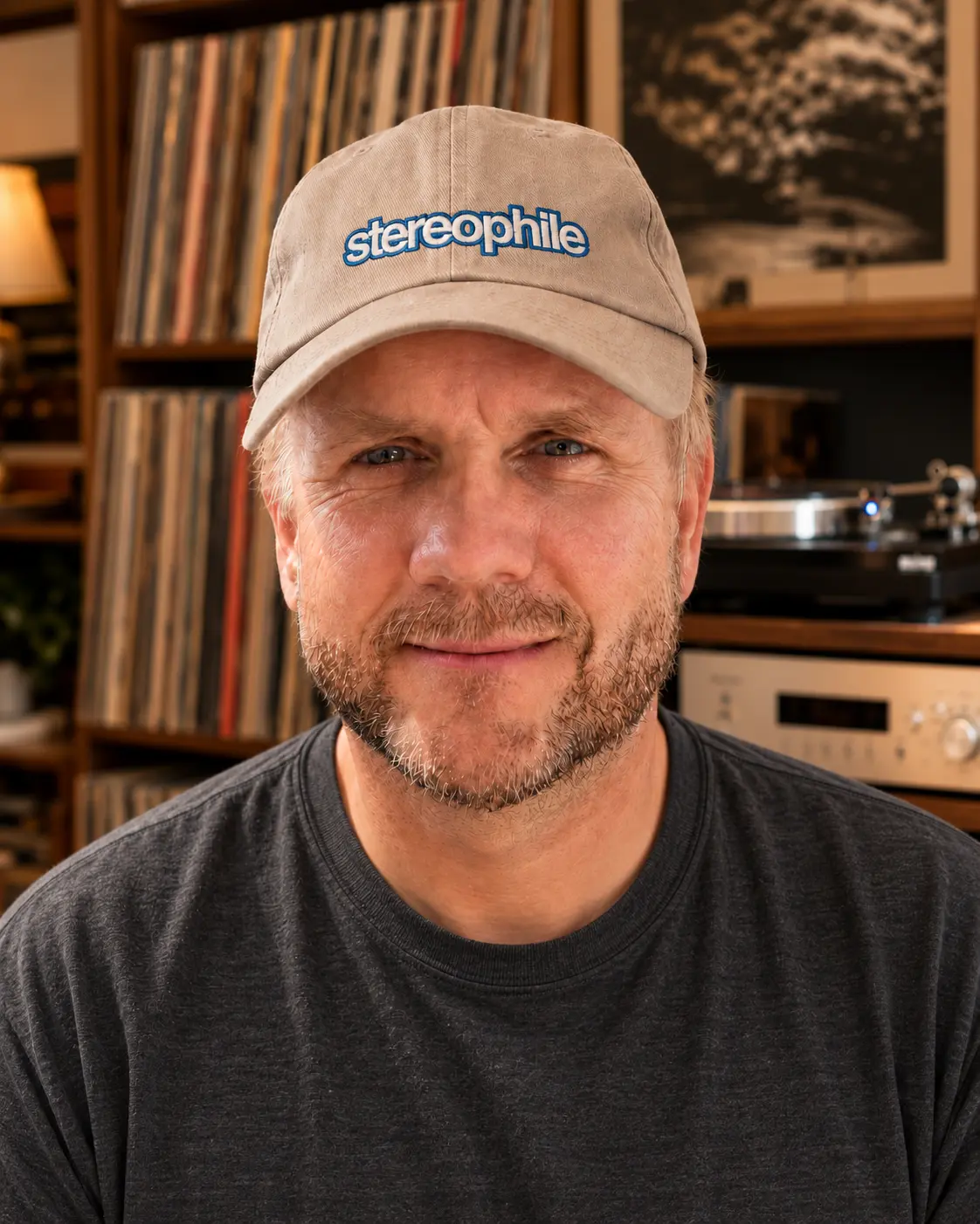 Rogier van Bakel in his listening room, wearing a Stereophile cap